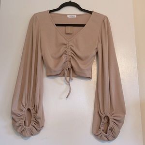 Beige bell sleeve cropped blouse.